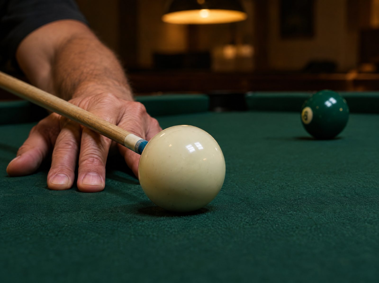 A printed score sheet on a clipboard at the pool table